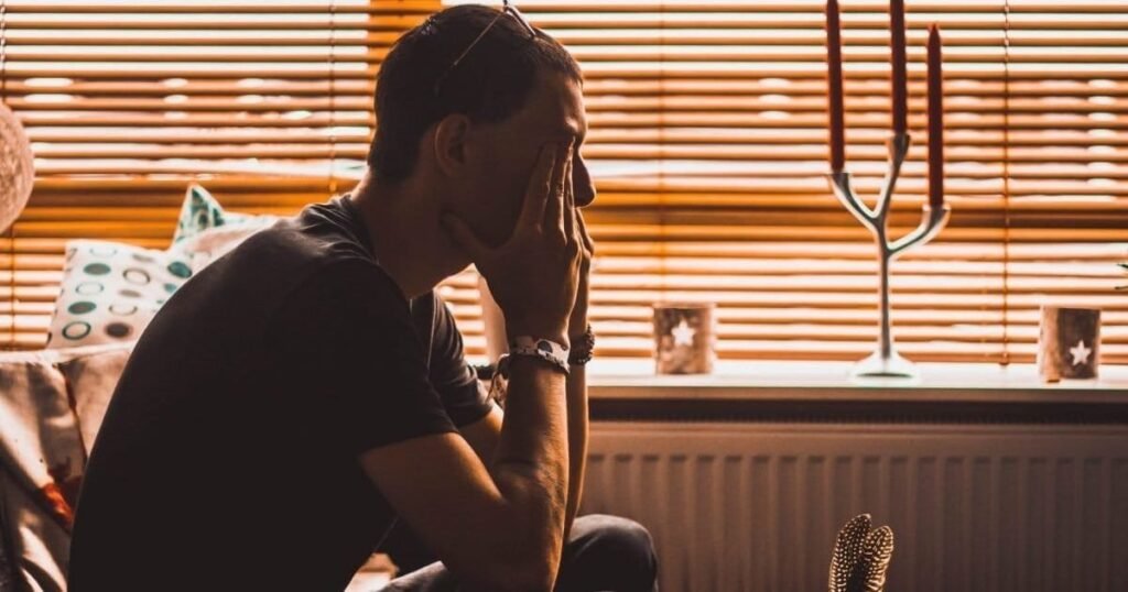 Depressed man sitting on chair