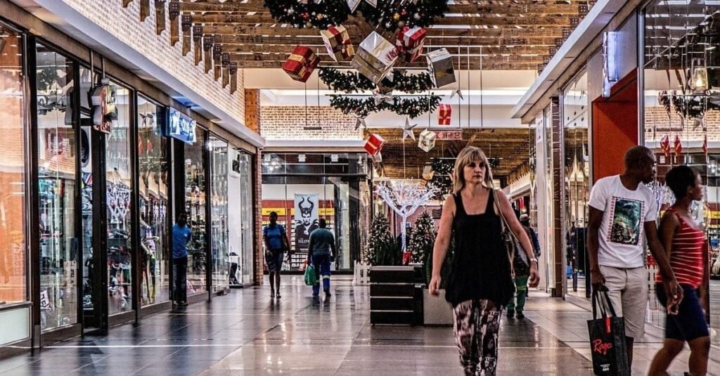Consumerism, a consumer lifestyle is encouraging us to spend money that we don't have. A woman is shopping
